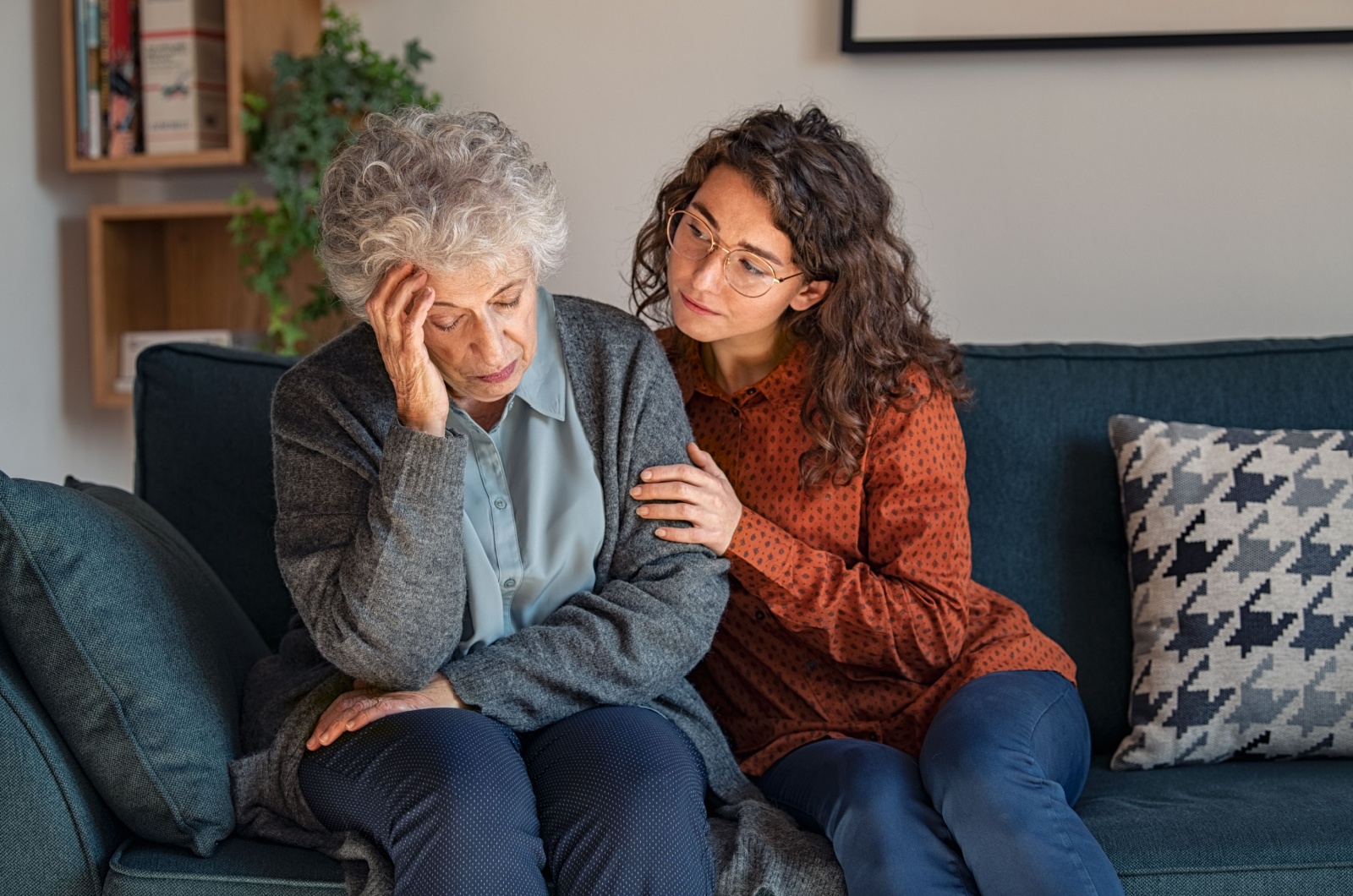 A concerned adult child comforting a parent who is experiencing personality changes.